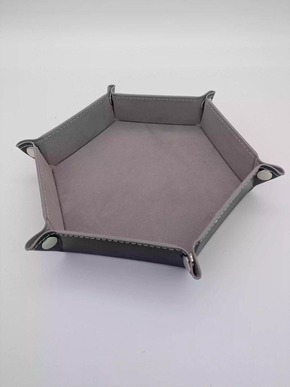 Collapsible grey velvet dice tray showing the 4 heavy-duty metal snaps for quick assembly.